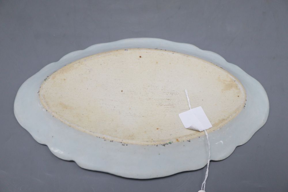 A Chinese famille rose oval dish and three hardwood stands, width 27cm